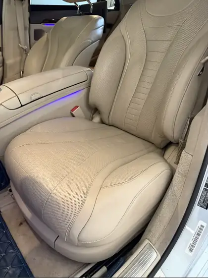 Leather driver seat side bolster after crack repair in Denver